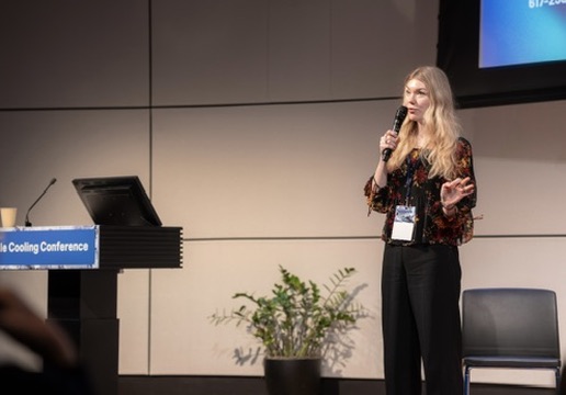Anna Albright delivering a keynote at a cooling conference